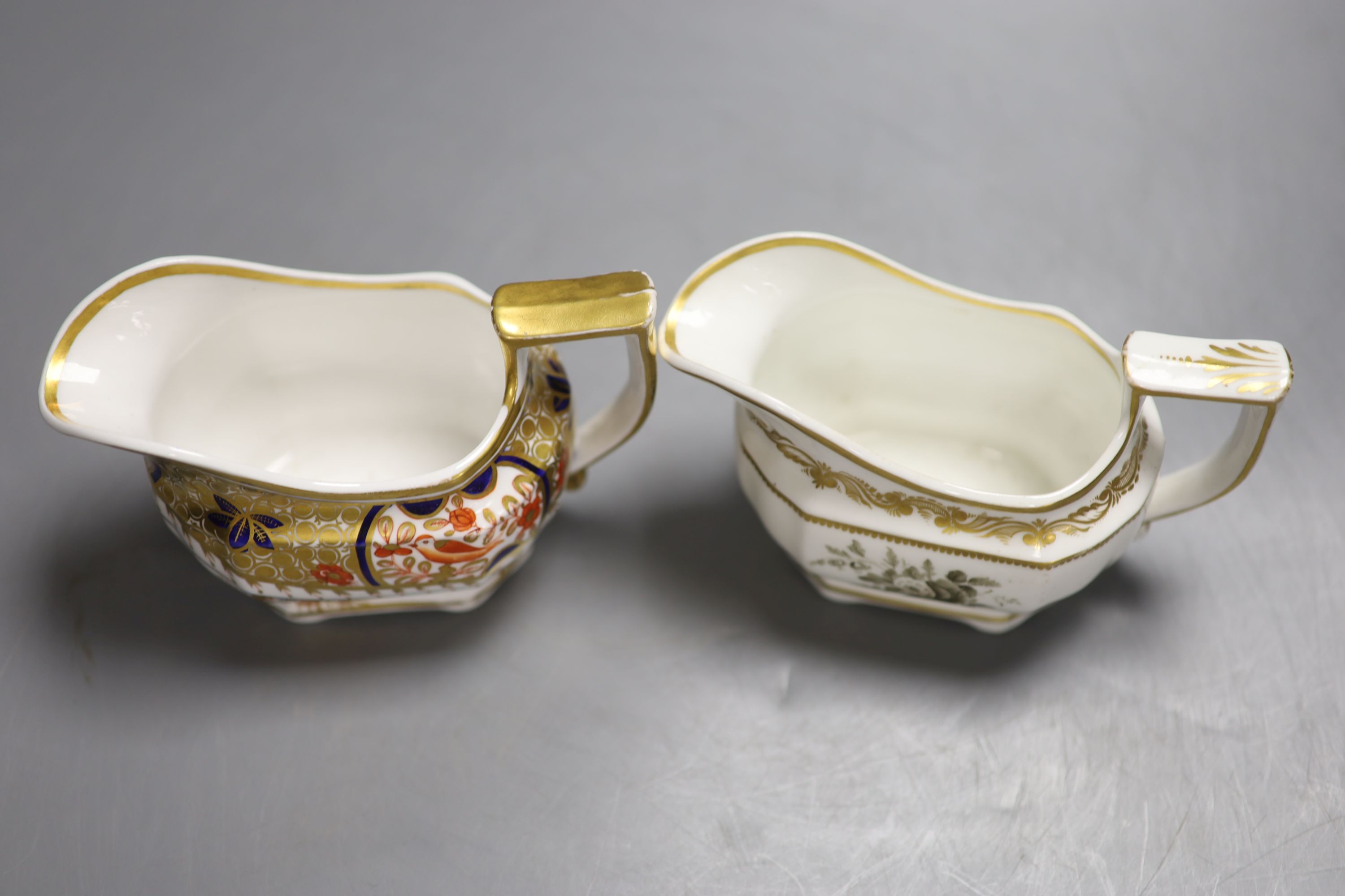 A Spode cream jug painted with Imari pattern 1495, and a Spode cream jug painted with sepia flowers under a gold border, pattern 3527,